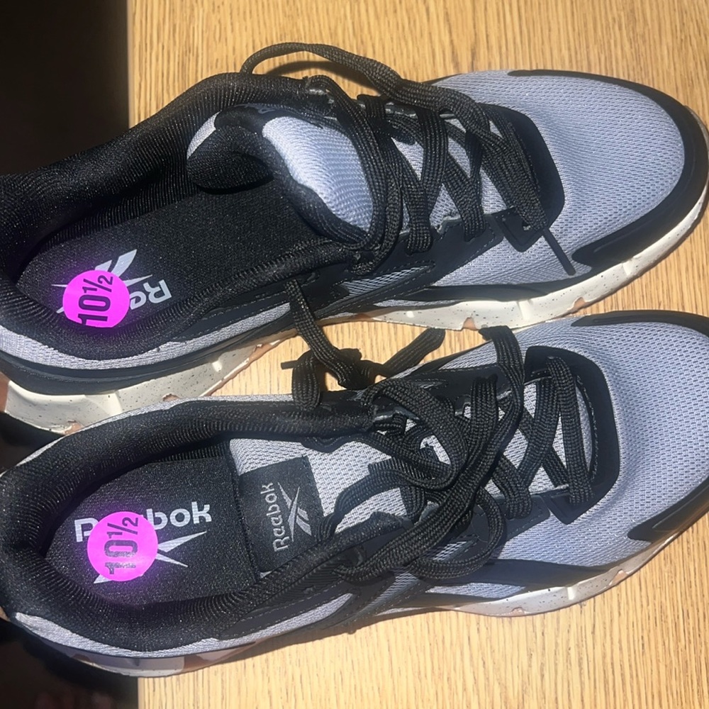 Reebok tennis shoes. Never used, gray, black and white, very comfortable.